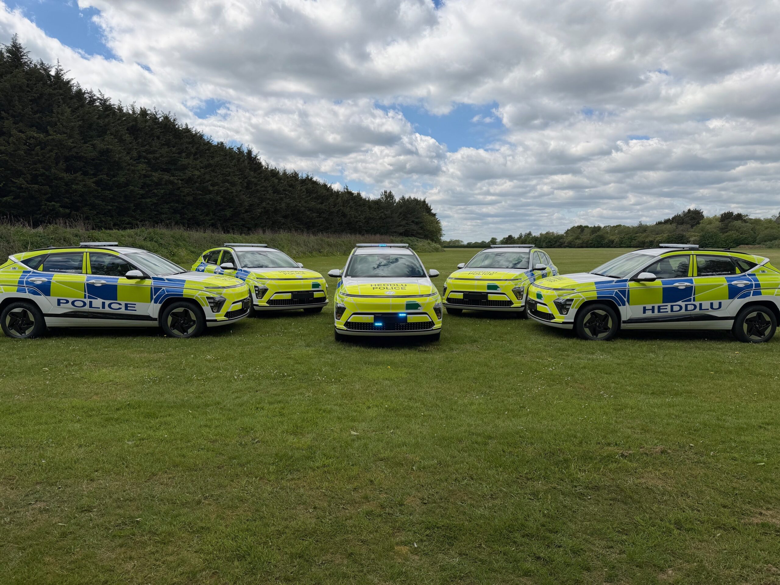 Police Hyundai Kona fleet, five vehicles lined up in a field