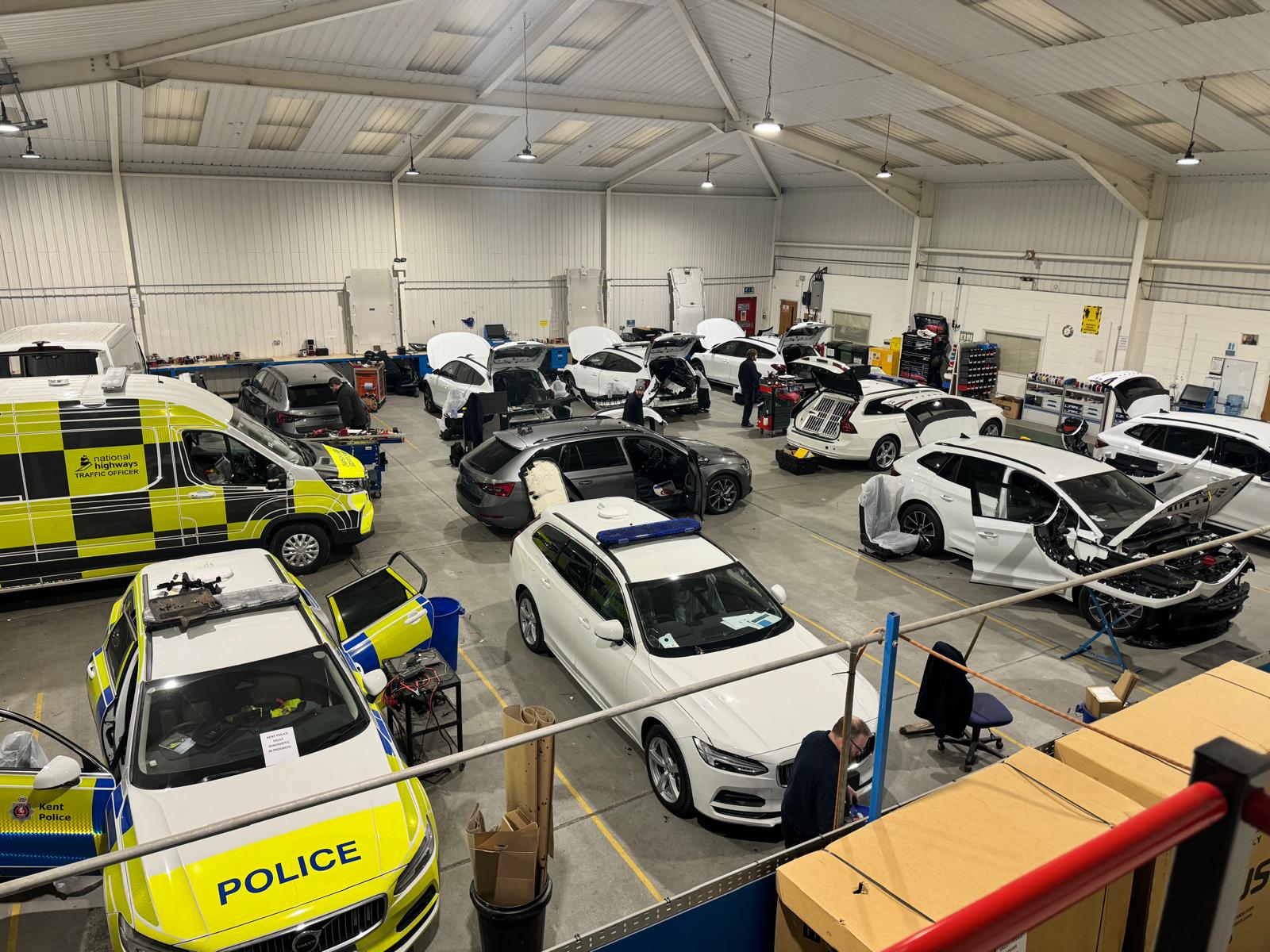 Police Toyota Corolla with fleet vehicles, exhibition hall