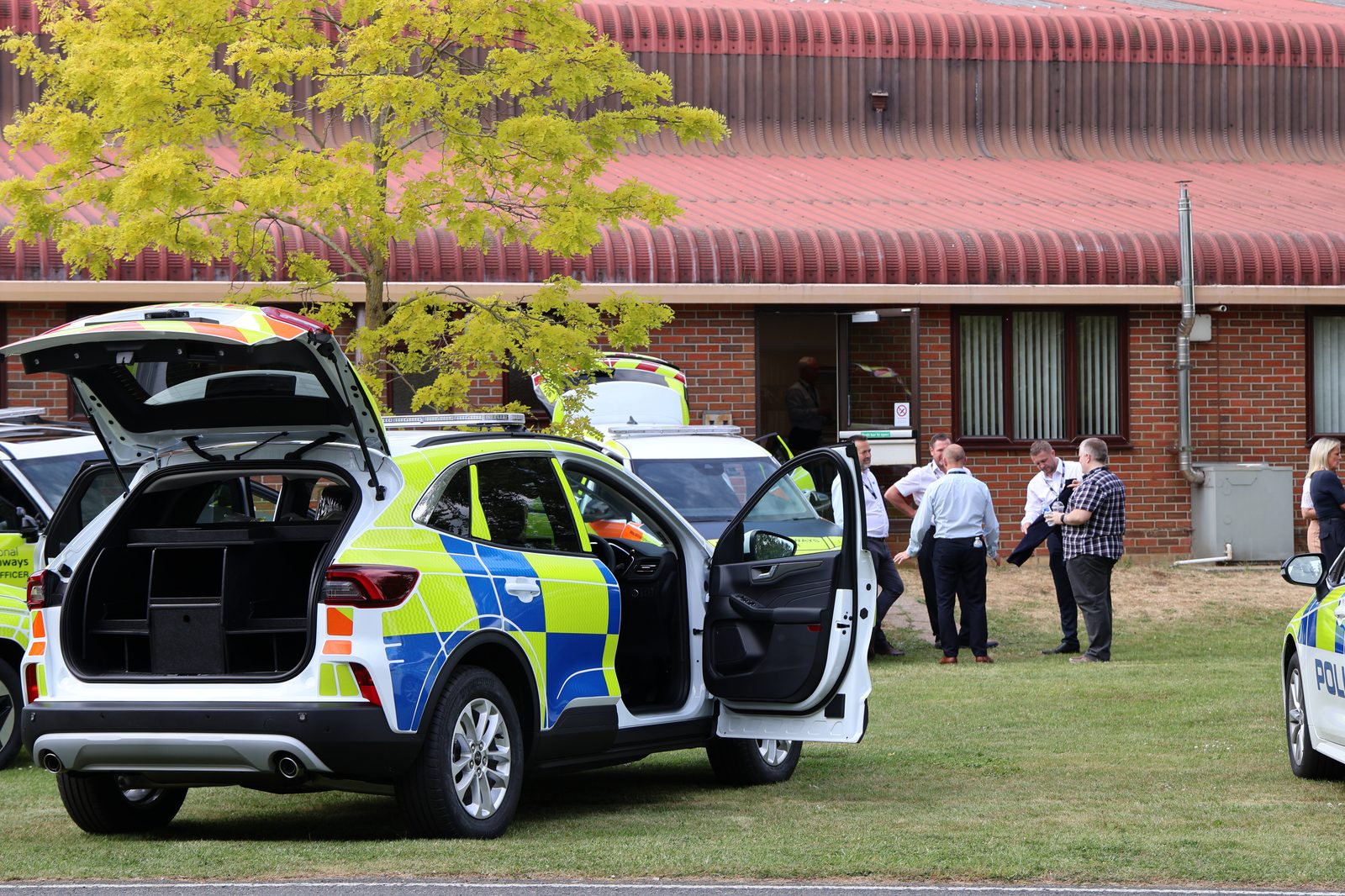 Visitors viewing a converted vehicle