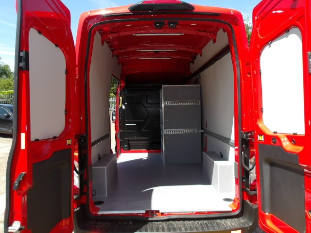 Fire service van interior, rear doors open showing storage