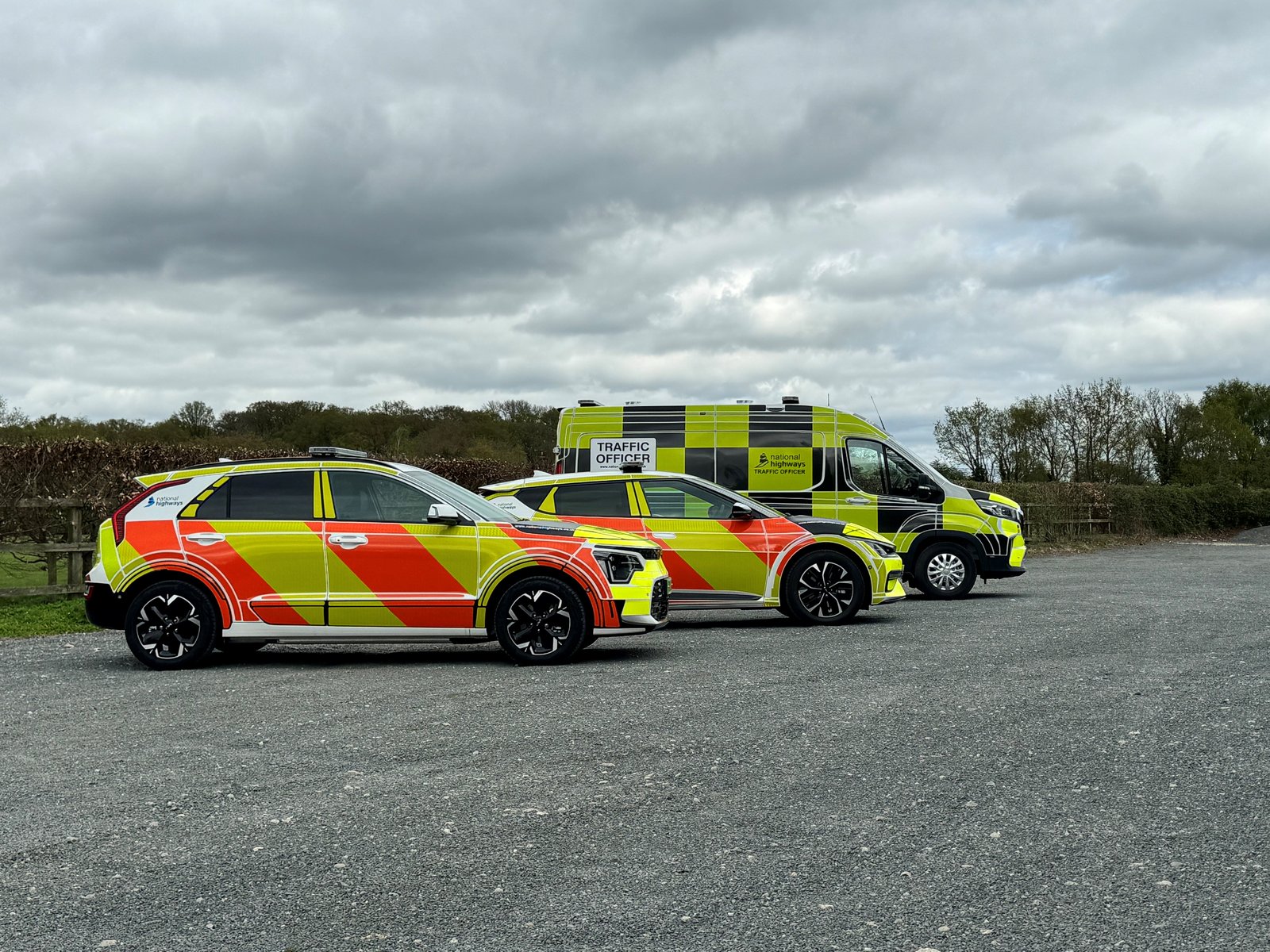National Highways Traffic Officer vehicles, side view of three
