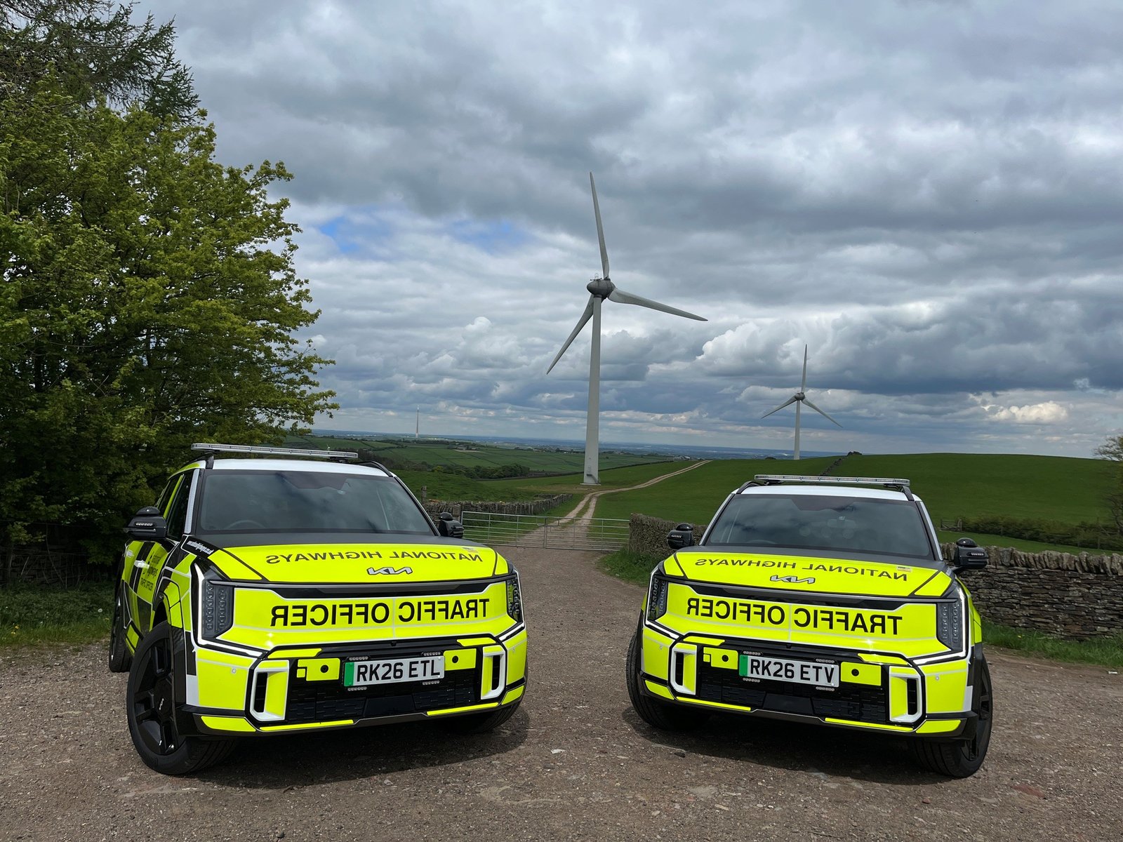 National Highways Traffic Officer vehicles, front view with wind turbines