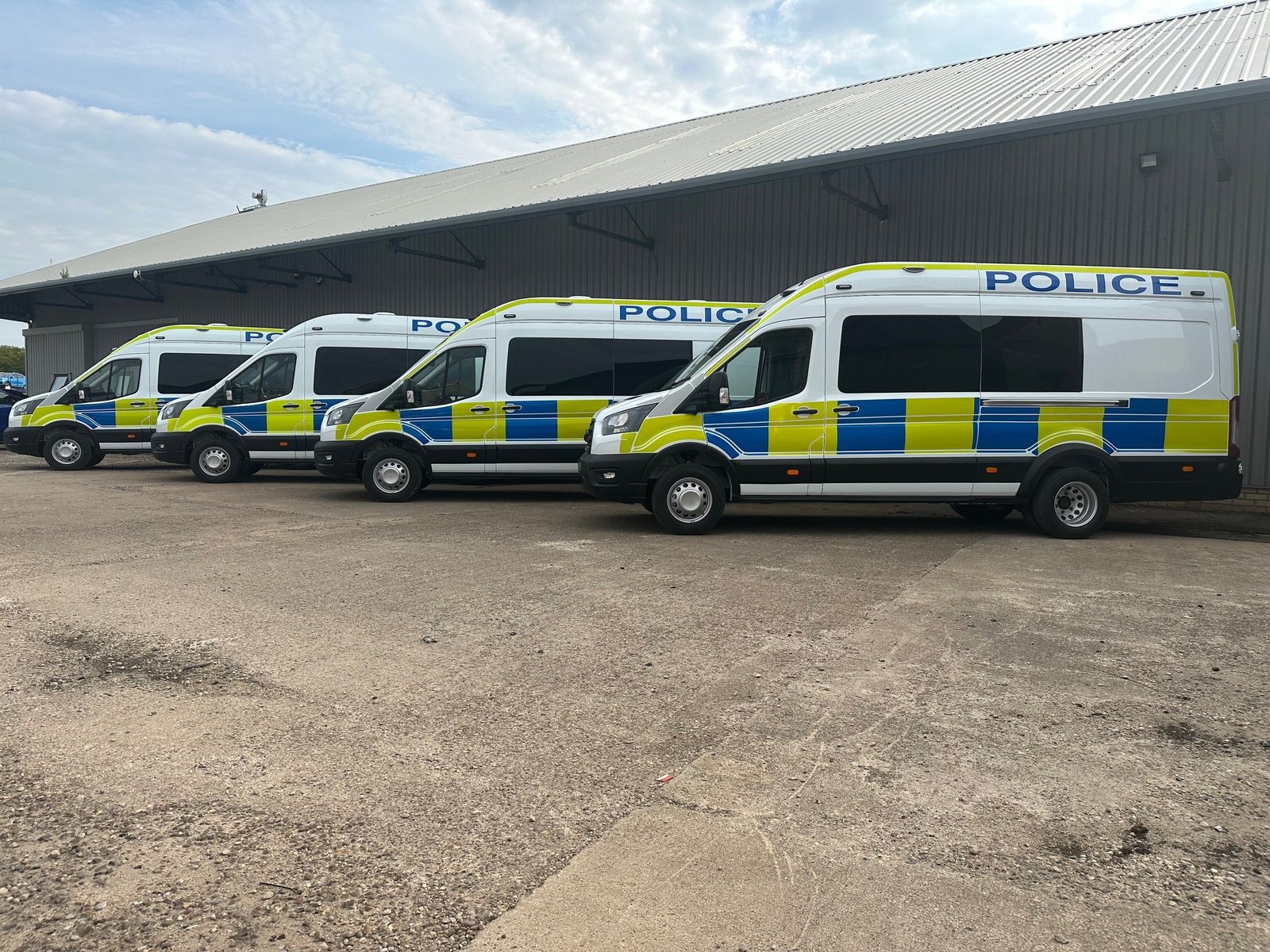 Fleet of PSU conversions lined up outside the workshop